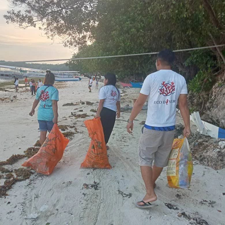 Carrying bags of collected trash